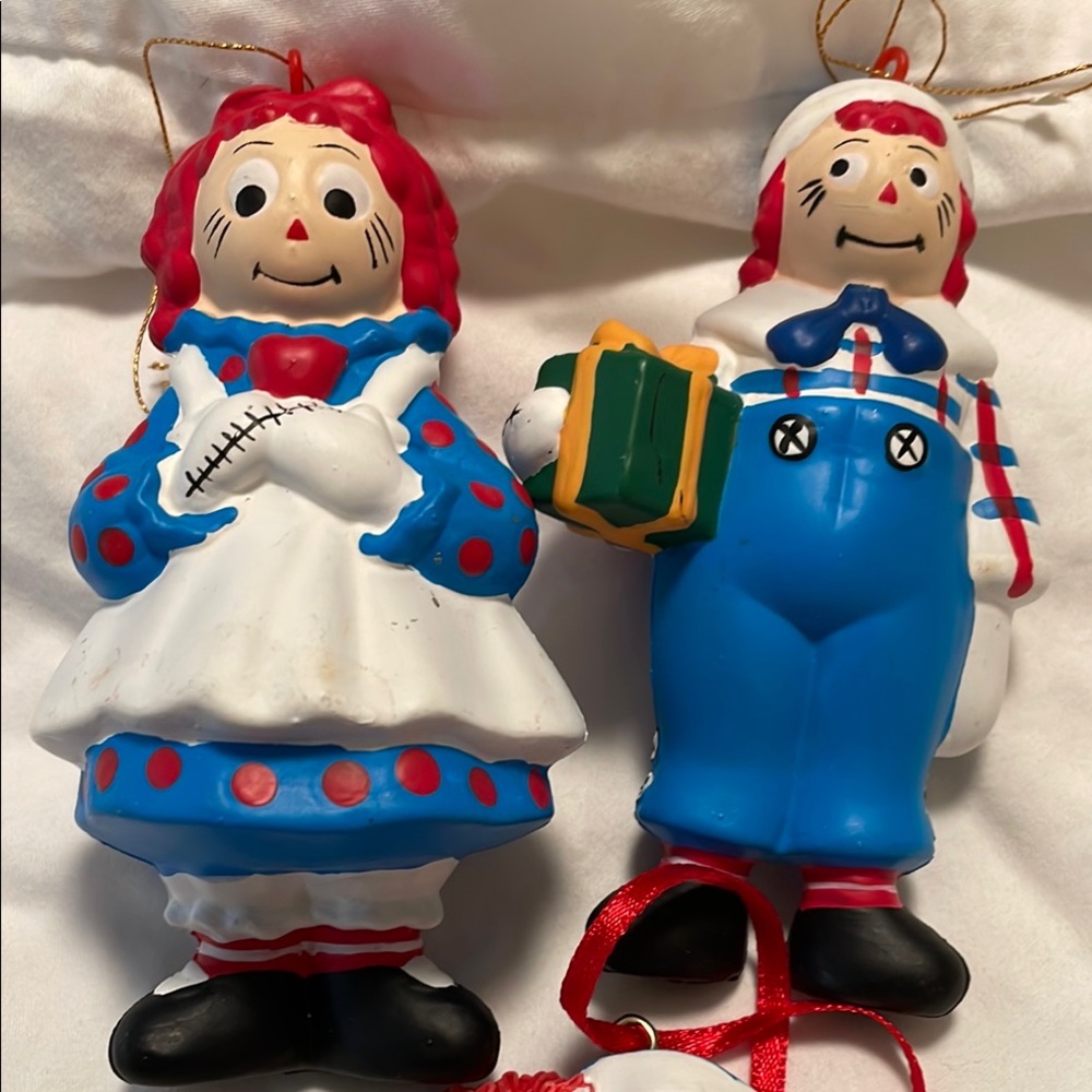 Set of three Raggedy Ann and Andy Christmas ornaments.